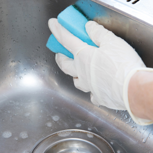 SMClean NW | Office Cleaning Chester, North Wales & Surrounding Areas | Scouring a stainless steel sink