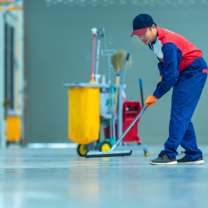 SMClean NW | Office Cleaning Chester, North Wales & Surrounding Areas | Man in overalls sweeping